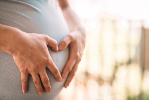 pregnant-woman-makes-heart-on-her-tummy-picjumbo-com